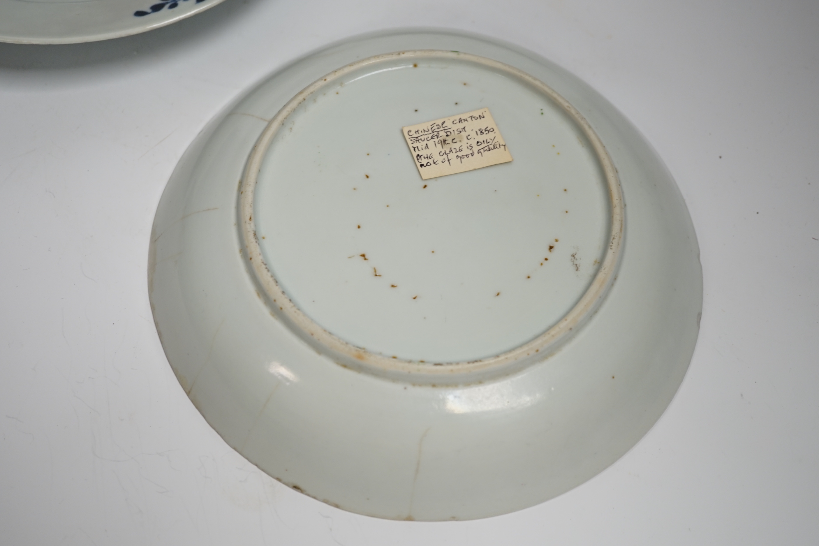 Two 18th century Chinese export plates and a 19th century Canton plate, largest 23cm